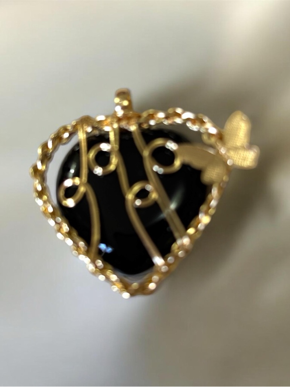 Gold-Tone Heart Pendant with Black Onyx Inset and Butterfly Accent
